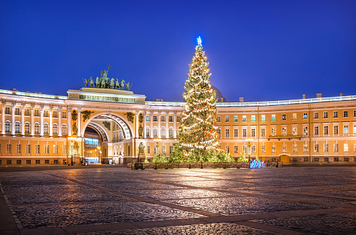 New Year's tree on the Palace Square and the arch of the General Staff building in St. Petersburg in the light of a blue winter night.