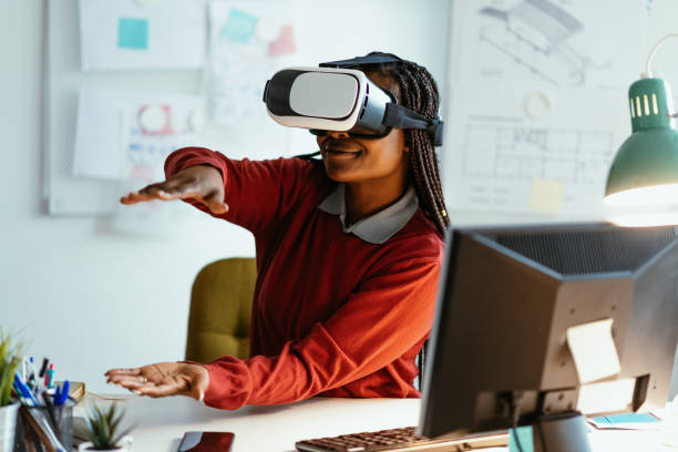 istock African-American businesswoman using Virtual Reality Simulator in office 1301266678