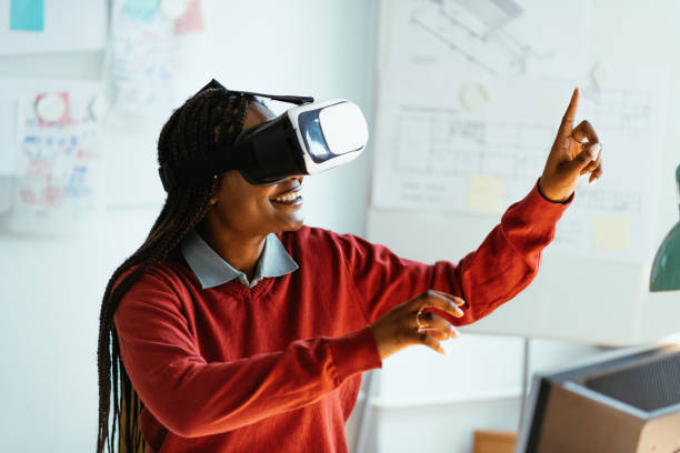 istock African-American businesswoman using Virtual Reality Simulator in office 1301266679