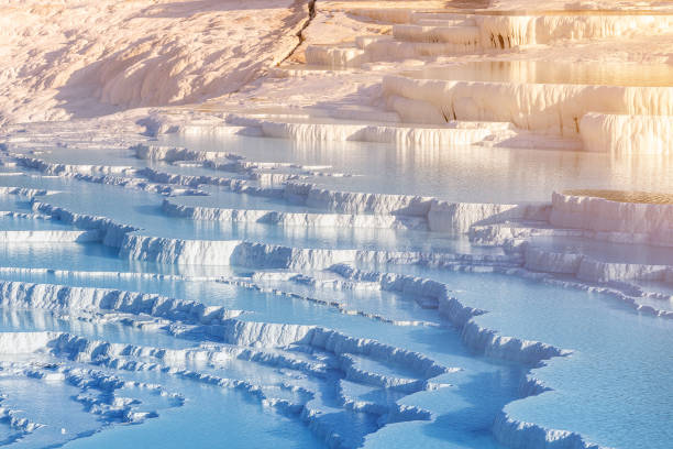 Pamukkale is the main natural wonder of Turkey and the Middle East. White travertines with thermal water. It is a very popular tourist attraction that attracts thousands of tourists. Pamukkale is the main natural wonder of Turkey and the Middle East. White travertines with thermal water. It is a very popular tourist attraction that attracts thousands of tourists. denizli stock pictures, royalty-free photos & images