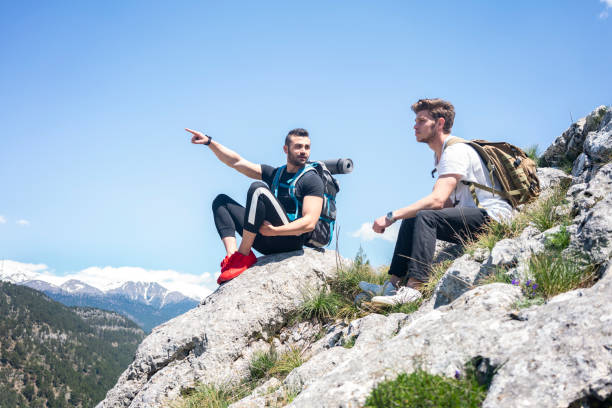 istock Two climbers on top of mountains. 1301268097