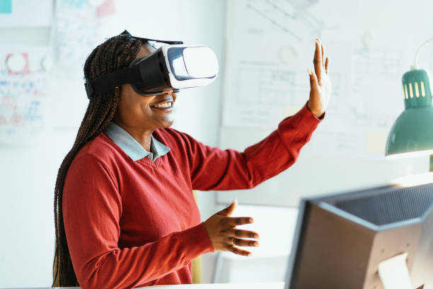 istock African-American businesswoman using Virtual Reality Simulator in office 1301268426