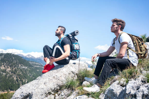 istock Two climbers on top of mountains. 1301269207