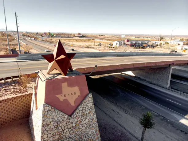 Photo of The Texas Border, State Line Marker Coming From Anthony, New Mexico Entering El Paso County, El Paso, Texas, Drone View