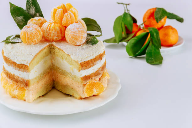 istock Cut sponge cake with mandarin cream. 1301273110