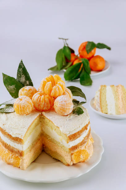 istock Cut sponge cake with mandarin cream. 1301273130