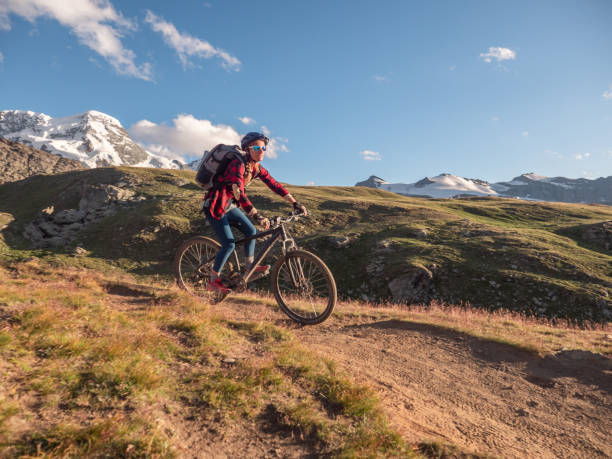 istock Mountain biker on dirt trail, Switzerland 1301275564