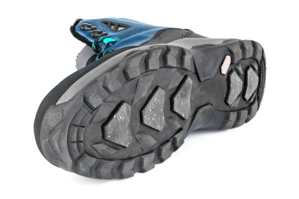 istock insulated blue winter warm three quarter sneaker or boot isolated on white background, laid on side 1301275598