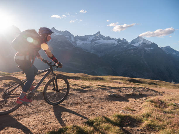 istock Mountain biker on dirt trail, Switzerland 1301275618