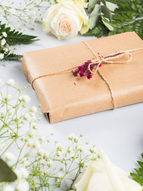 istock Gift box with dried flowers decor with roses around 1301276484