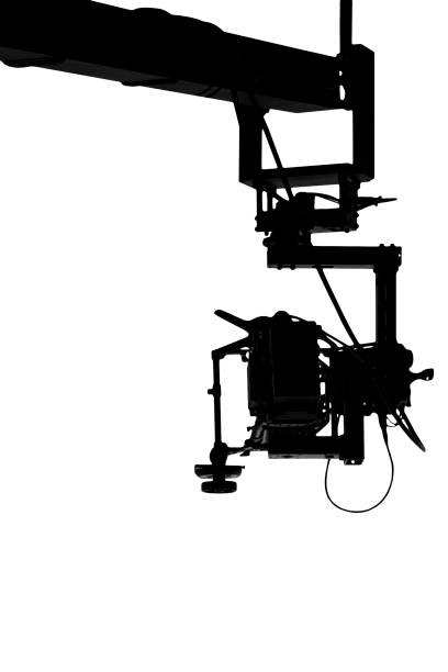 silhouette of a movie camera on a crane - filmando com guindaste imagens e fotografias de stock