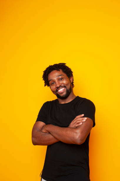 istock young handsome african american guy student posing cheerful and gesturing on yellow background, lifestyle people concept 1301276756