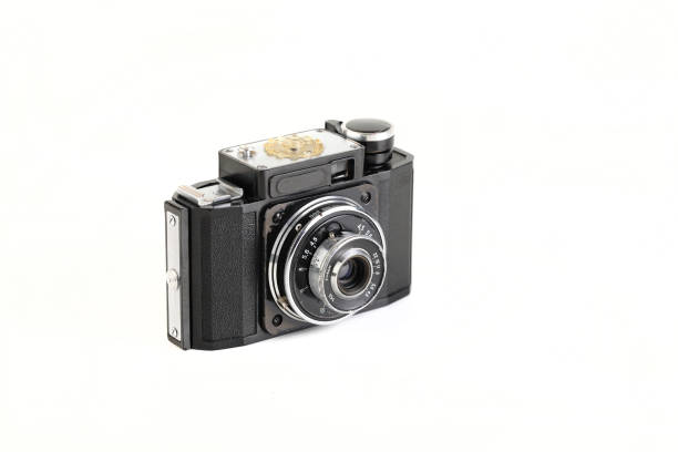 istock Old 35mm bakelite scaling film camera on white background. 1301276977