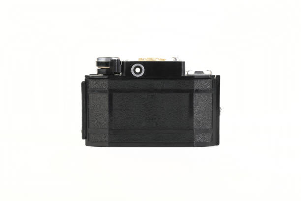 istock Old 35mm bakelite scaling film camera on white background. 1301276984