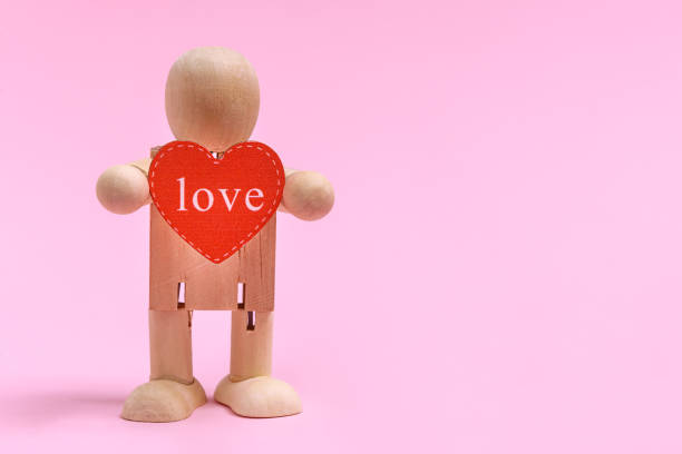 istock Toy wooden man with heart 1301277919