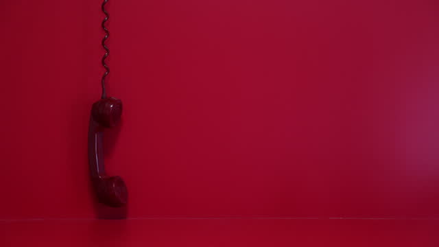Old red telephone handset