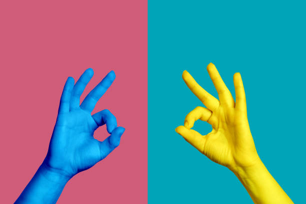 istock Two hands, one blue and the other yellow, show the gesture. 1301280419