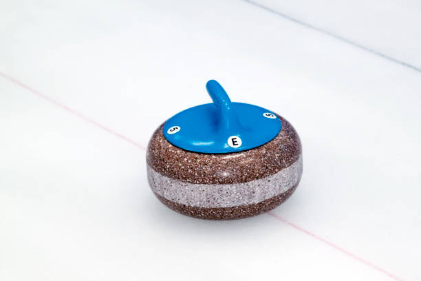 istock Close up view of single blue stone for Curling on the ice 1301280861