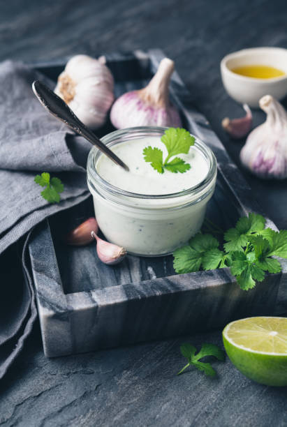 Cilantro garlic sauce with lime juice and olive oil stock photo