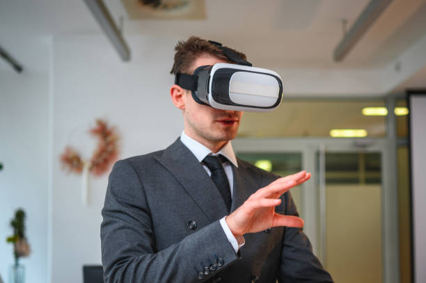 istock Mature Caucasian Businessman with Virtual Reality Simulator Working in Office 1301284825