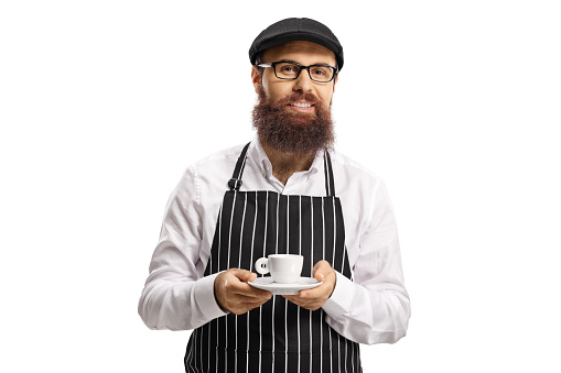 Bearded barista with an apron and an espresso coffee isolated on white background