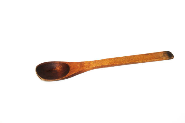 istock Antique used wooden spoon isolated on white background 1301293882