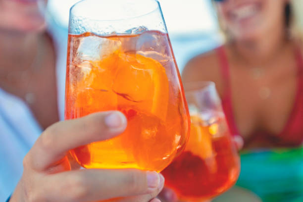 istock Couple toasting with a spritz cocktail outdoors. 1301295081