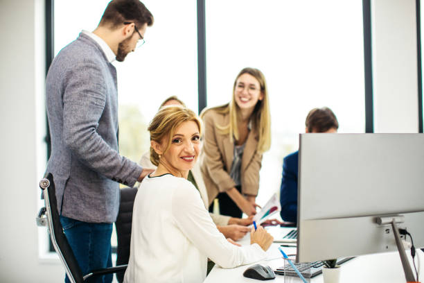 istock Group of business people working inside modern office 1301296623