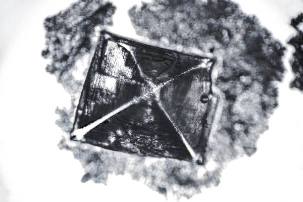 Amazing salt crystal close up under the light microscope. Grown crystal of table salt