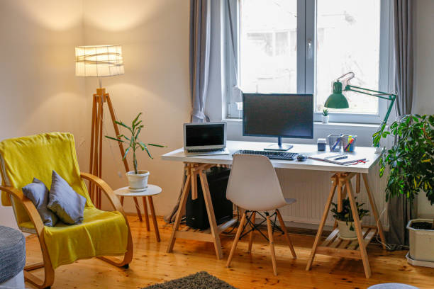 istock Table with laptop in home office interior. stock photo 1301298039