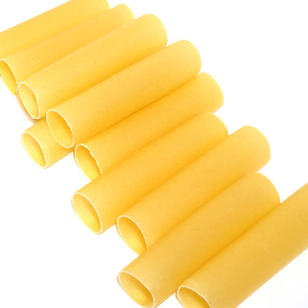 istock Yellow cannelloni pasta isolated on white background 1301298087