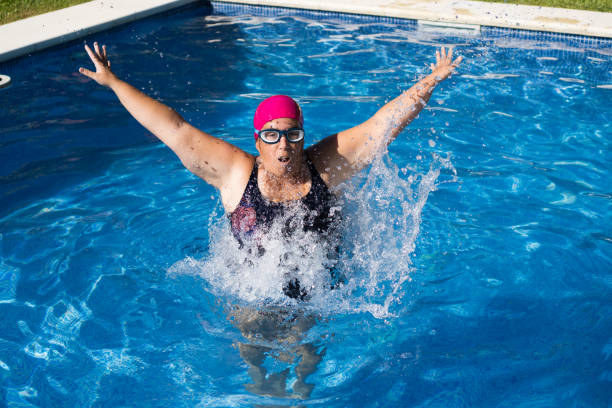 istock young woman in the swimming pool 1301298143