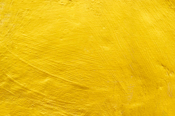istock Gold concrete wall texture or background  and copy space. 1301298165
