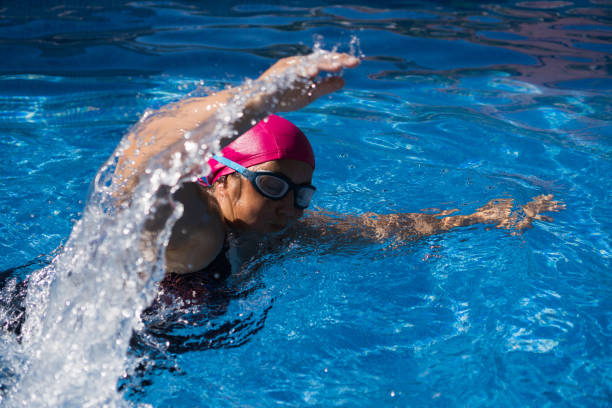 istock young woman in the swimming pool 1301298683