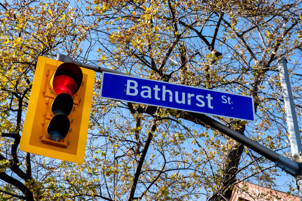 istock Bathurst Street sign with traffic light is seen in downtown Toronto, Canada. 1301299085