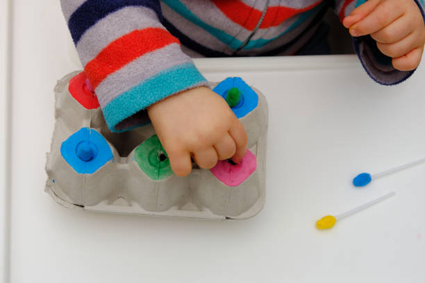 istock Home made baby egg carton toy 1301301357