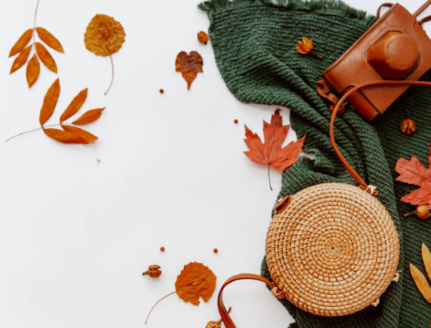 istock Creative autumn flat lay with rattan modern bag and old retro camera, blogger concept 1301302028
