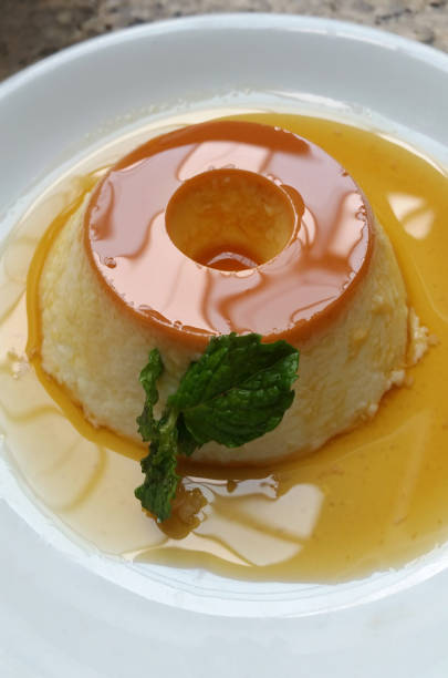 istock Homemade caramel cream pudding with mint. 1301302411