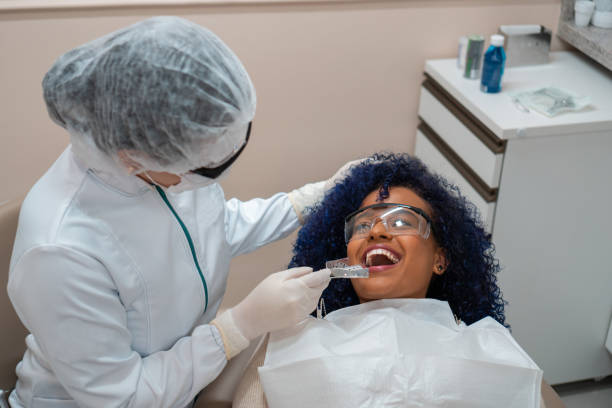 istock Dentist testing dental mold on patient 1301303221