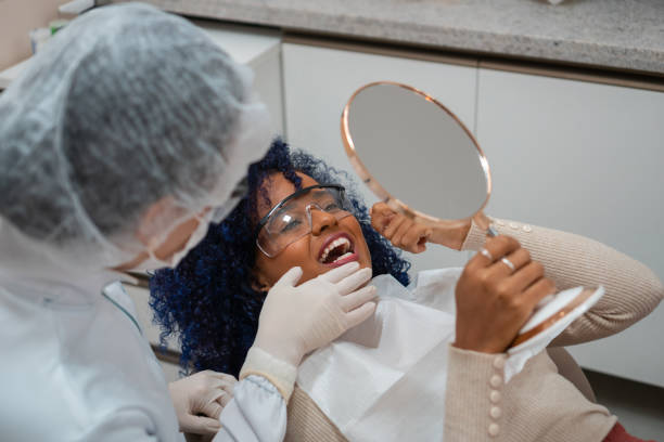 istock Young woman at the dentist 1301303226