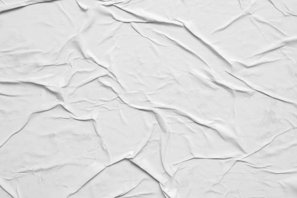 istock Blank white crumpled and creased paper poster texture background 1301308376