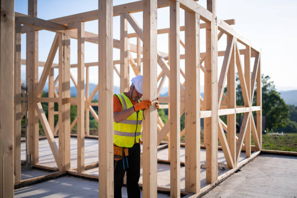 istock Senior builder working on a wooden house in nature. 1301308493