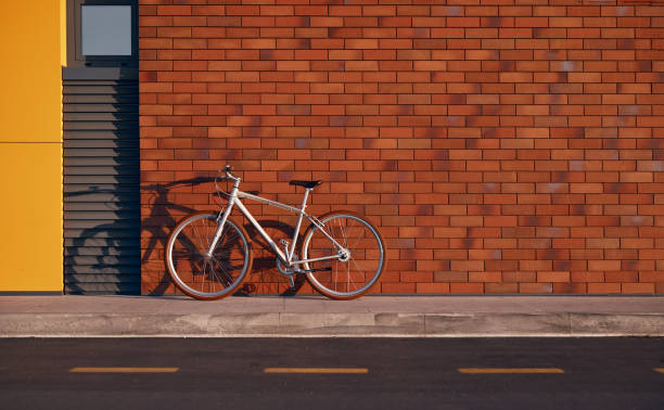 Bicycle parked outside shuttered windows in Bruges