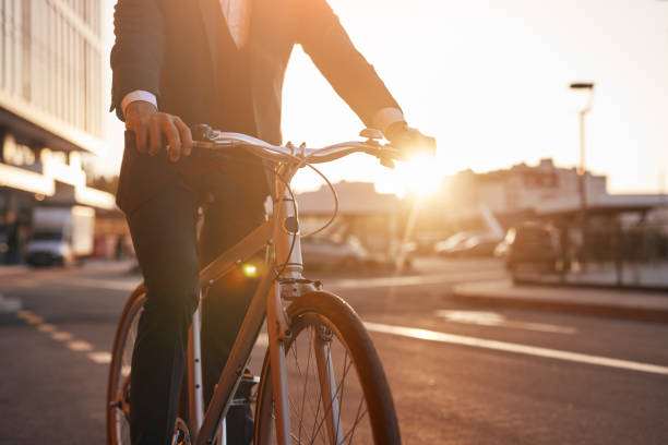 istock Crop entrepreneur riding bicycle in evening 1301309206