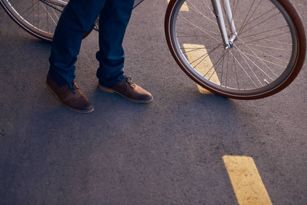 istock Crop man with bicycle crossing road 1301309218