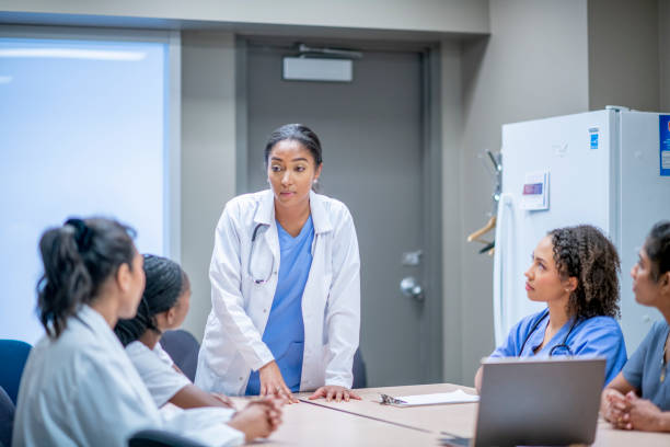 istock Doctor and nurses meeting together 1301309252