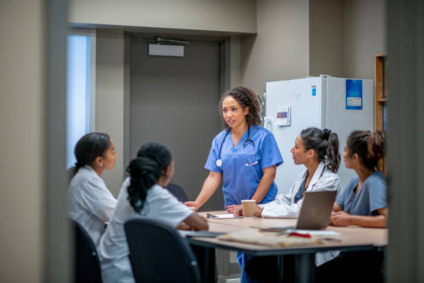 istock Doctor and nurses meeting together 1301309254