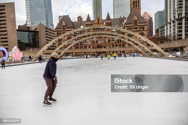 Skating At Nathan Phillips Square Stock Photo - Download Image Now - Toronto, Arch - Architectural Feature, Architecture