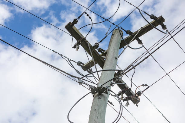 istock Power Pole and Electricity Wires 1301313920