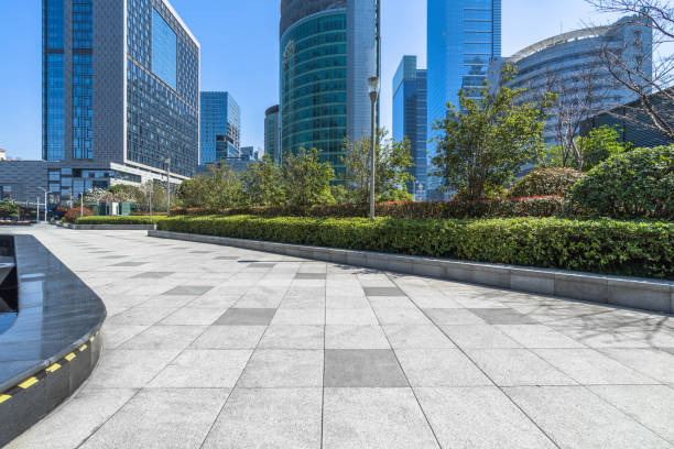 istock empty pavement and modern buildings in city 1301318104